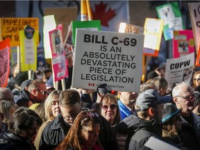 Protesters outside an event Prime Minister Justin Trudeau is attending in Calgary, Alta., Thursday, Nov. 22, 2018.