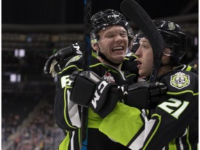 The Edmonton Oil Kings' Wyatt McLeod, left, and Jake Neighbours celebrate Neighbours' second period goal against the Lethbridge Hurricanes at Rogers Place, Sunday, Oct. 28, 2018.
