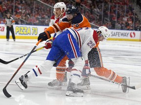 The Edmonton Oilers' Leon Draisaitl (29) battles the Montreal Canadiens' Jeff Petry (26) and Andrew Shaw (65) during first period NHL action at Rogers Place, in Edmonton Tuesday Nov. 13, 2018. Photo by David Bloom