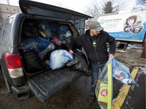 Josh Hudon drops off 49 bags of clothing to the Bissell Centre Thrift Shop at 8818 118 Ave. in Edmonton on Monday, Nov. 19, 2018.