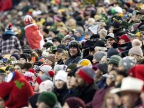 Football fans watch the Calgary Stampeders battle the Ottawa Redblacks during first half Grey Cup action at Commonwealth Stadium, in Edmonton Sunday November 25, 2018. Photo by David Bloom