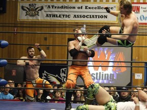 Local wrestlers compete at the Prairie Wrestling Alliance (PWA) 15th Anniversary show at the NAIT gymnasium in downtown Edmonton on March 26, 2016.