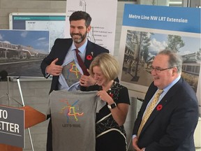 Edmonton Mayor Don Iveson, left, Premier Rachel Notley and Transportation Minister Brian Mason as the province announced $1 billion in LRT funding.