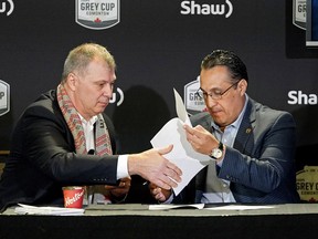 CFL commissioner Randy Ambrosie, left, and Oscar Perez, CEO of Liga de Futbol Americano Profesional in Mexico, sign a letter of intent in Edmonton on Friday, Nov. c23, 2018 that will see them work together on several projects, including possible CFL games in Mexico.