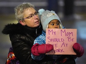 Kathie McCullough and her four-year-old granddaughter Kenisha Ellinger showed their support at a rally held at Churchill Square in downtown Edmonton on Saturday, Nov. 17, 2018, in support of city employees who experienced harassment and discrimination at the workplace.