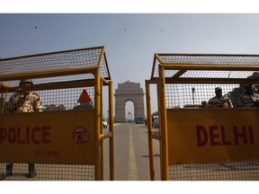 With help from police in India, the Mounties say they've dismantled three major operations there and arrested a dozen people here in Canada who are involved in the frauds. They've counted 4,000 victims who've lost $15 million. Virtually none of the money has been recovered. Indian policemen stand guard near India Gate in New Delhi, India, Tuesday, Jan. 8, 2013.