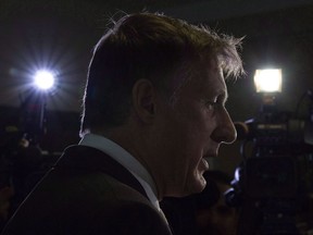 Maxime Bernier speaks with the media after filing papers for the Peoples Party of Canada at the Elections Canada office in Gatineau, Que., Wednesday, October 10, 2018. An alleged white supremacist who was kicked out of Alberta's United Conservative Party found a new political home in Maxime Bernier's fledgling People's Party of Canada, at least briefly.