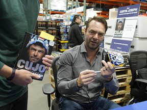 Former Edmonton Oilers goaltender Curtis Joseph signed copies of his new book for hundreds of fans at the south Edmonton Costco store on Saturday November 10, 2018. (PHOTO BY LARRY WONG/POSTMEDIA)