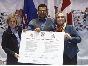 Alberta Premier Rachel Notley, Chief Billy Joe Laboucan and Minister of Crown Indigenous Relations Carolyn Bennett sign a historic land deal with the Lubicon Lake First Nation, in Little Buffalo, Alta. on Tuesday November 13, 2018.