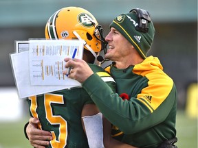 Edmonton Eskimos head coach Jason Maas gives Vidal Hazelton (15) a hug after defeating the Winnipeg Blue Bombers 33-24 during CFL action in the last game of the season at Commonwealth Stadium in Edmonton, Nov. 3, 2018.