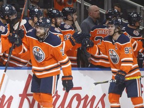 Edmonton Oilers' Leon Draisaitl, left, and Connor McDavid celebrate a goal against the Montreal Canadians on Nov. 13, 2018, during first-period NHL action in Edmonton.