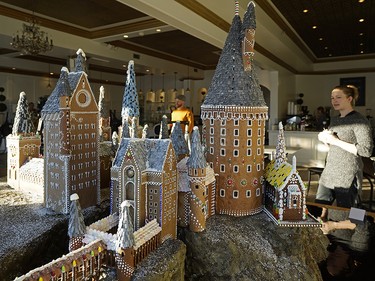 This year Duchess Bake Shop owners Garner Beggs and wife Kelsey Johnson constructed a 1:100 scale replica of Hogwarts Castle. It is based on the model built in England where the Harry Potter movies were filmed. They spent hundreds of hours building the edible gingerbread castle as a fundraiser for tbe Bissell Centre. Anyone dropping off a pair of socks can enter to win the castle. (PHOTO BY LARRY WONG/POSTMEDIA)