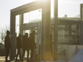 People enter the river valley funicular March 5, 2018. The funicular will be closed until mid-December to allow for cold weather-related upgrades.