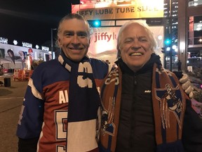 Claude Martel (left) and Alain Charland flew from Montreal to Edmonton on Wednesday for the first night of 2018 Grey Cup festivities. Martel, a MontrÈal Alouettes fan, regularly travels to catch Grey Cup games and meet up with an extended "family" of CFL fans.