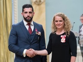 Justin Yaassoub being awarded the Bravery Medal by the Governor General for risking his life to save an injured soldier during an international operation.