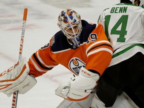 Dallas Stars captain Jamie Benn (right) runs into Edmonton Oilers goalie Mikko Koskinen during second period NHL hockey game action in Edmonton on Tuesday November 27, 2018. (PHOTO BY LARRY WONG/POSTMEDIA)