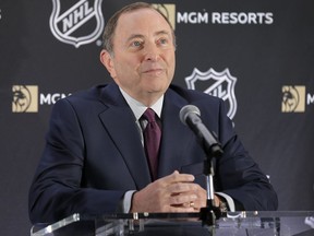 FILE - In this Oct. 29, 2018, file photo, National Hockey League commissioner Gary Bettman speaks during a news conference in New York. The NHL and lawyers for retired players say a tentative settlement has been reached in a concussion lawsuit brought against the league. The league and players' lawyers on Monday, Nov. 12, 2018, announced a tentative non-class settlement had been reached in the consolidated case after months of court-ordered mediation. The lawsuit involved more than1 00 former players who accused the NHL of failing to better prevent head trauma or warn players of such risks while promoting violent play that led to their injuries.