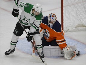 Edmonton Oilers goalie Mikko Koskinen makes a save on Dallas Stars Mattias Janmark (left) during second period NHL hockey game action in Edmonton on Tuesday November 27,2018.