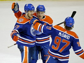 Edmonton Oilers Oscar Klefbom (left) celebrates his game winning goal late in the thrid period with team mates Ryan Nugent-Hopkins (middle) and Connor McDavid (right) during third period NHL hockey game action in Edmonton on Thursday November 29, 2018. The Oilers defeated the Kings by a score of 3-2.