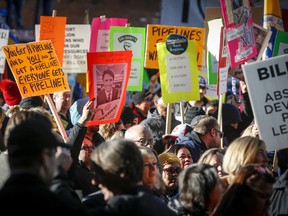 Protesters outside an event Prime Minister Justin Trudeau is attending in Calgary Thursday.