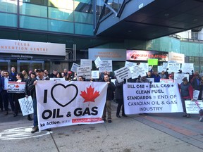 Pipeline supporters gather outside Telus Convention Centre in downtown Calgary on Tuesday, Nov. 27, 2018, where Finance Minister Bill Morneau is scheduled to speak.