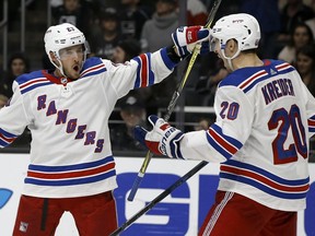 New York Rangers center Ryan Spooner, left, celebrates his goal against the Los Angeles Kings with left wing Chris Kreider during the third period of an NHL hockey game in Los Angeles, Sunday, Oct. 28, 2018.