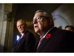 Ralph Goodale, Minister of Public Safety and Emergency Preparedness, and Bill Blair, Minister of Border Security and Organized Crime Reduction, make a funding announcement on combatting gun and gang violence during a press conference on Parliament Hill in Ottawa on Thursday, Nov. 8, 2018.