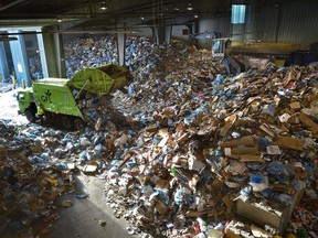 Residential recycling material being sorted at the materials recycling facility on Thursday, Dec. 27, 2018. The city collects more than twice the amount of recycling and waste in the two weeks after Christmas then is typical for the rest of January and February combined.