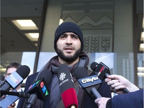 Omar Khadr appears at the courthouse in Edmonton with his lawyer in hopes of getting a Canadian Passport to travel to Saudi Arabia and permission to speak with his sister in Edmonton, December 13, 2018.