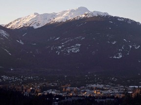 The village of Whistler, B.C. is seen as the sun sets on the snow capped mountains. File photo.