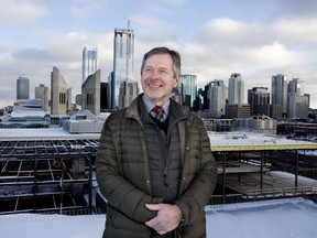 MacEwan University Associate Vice President Stuart MacLean poses for a photo, in Edmonton Wednesday Dec. 5, 2018. The under construction Students' Association of MacEwan University building is visible behind MacLean.