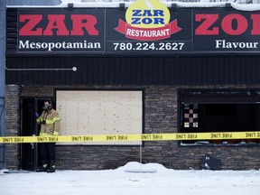 Firefighters continue to work at the scene of a fire at Zar Zor Restaurant, 12118 90 St., in Edmonton on Wednesday, Dec. 5, 2018.
