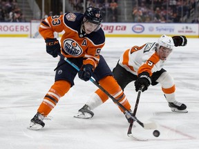 The Edmonton Oilers' Ryan Nugent-Hopkins (93) battles the Philadelphia Flyers' Ivan Provorov (9) during third period NHL action at Rogers Place, in Edmonton Friday Dec. 14, 2018. The Oilers won 4-1. Photo by David Bloom