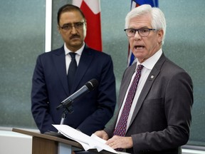 Natural Resources Minister Amarjeet Sohi, left, and International Trade Diversification Minister Jim Carr at a news conference where the federal government announced $1.6 billion in support of Canada's oil and gas sector at NAIT in Edmonton on Tuesday, Dec. 18, 2018.