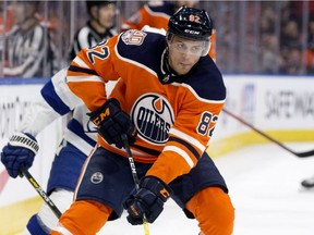 Edmonton Oilers' Caleb Jones (82) battles the Tampa Bay Lightning during second period NHL action at Rogers Place, in Edmonton Saturday Dec. 22, 2018. Tampa Bay won 6-3. Photo by David Bloom