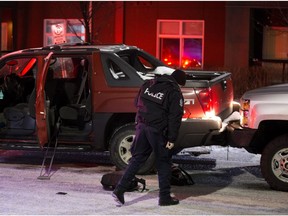 Police at the scene of an officer-involved shooting near 79 Avenue and 71 Street in Edmonton on Wednesday, Dec. 26, 2018.