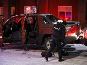 Police at the scene of an officer-involved shooting near 79 Avenue and 71 Street in Edmonton on Wednesday Dec. 26, 2018.