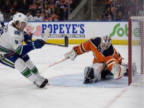 Vancouver Canucks' Brock Boeser (6) scores on Edmonton Oilers' goalie Mikko Koskinen (19) during first period NHL action at Rogers Place, in Edmonton Thursday Dec. 27, 2018. Photo by David Bloom