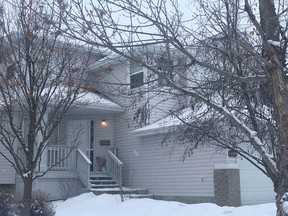 Flowers wrapped in paper were left on the steps of a Breckenridge Greens home on Saturday, Dec. 29, 2018, the day after a suspected domestic violence killing that left a 49-year-old woman dead.