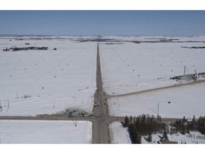 The wreckage of a fatal crash outside of Tisdale, Sask., is seen Saturday, April, 7, 2018. A consulting firm has recommended removing trees obstructing vision at an intersection where the Humboldt Broncos bus crash occurred. The 70-page safety review says the current view at the southeast corner of the intersection doesn't allow a clear sight line.