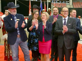 (L-R David Sibbald, Calgary Stampede President & Chairman of the Board, Premier Rachel Notley and Finance Minister Joe Ceci applaud during a massive funding announcement in Calgary on Tuesday, December 18, 2018. The announcement will help fund the expansion of BMO Centre and could be applied to an Arts Commons expansion and will also allow for infrastructure upgrades to Victoria Park. Jim Wells/Postmedia