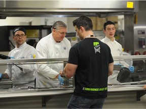 Workers are served dinner at the Cenovus Birch Creek Lodge oilsands work camp near Fort McMurray, Alberta. File photo.