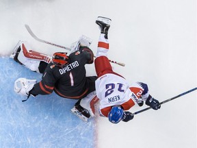 Czech Republic's Ondrej Machala defends against Team Canada's Nick Suzuki during the second period of Canada's 5-1 win on Saturday at Rogers Arena.