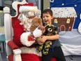 Stollery Childrenís Hospital patients meet with Santa during a visit to the hospital on Dec. 13, 2018. Santa was escorted to the hospital by the Edmonton Garrisonís 408 Tactical Helicopter Squadron where squadron personnel donated more than $1,000 to purchase more than 100 teddy bears for the children.