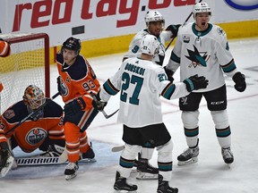 San Jose Sharks Tomas Hertl (48) celebrates his goal with Evander Kane (9) and Joonas Donskoi (27) on Edmonton Oilers goalie goalie Cam Talbot (33) during NHL action at Rogers Place in Edmonton, December 29, 2018.