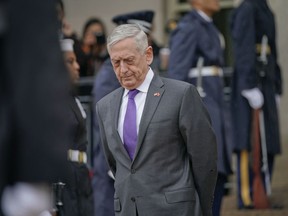 FILE - In this Nov. 9, 2018, file photo, Defense Secretary Jim Mattis waits outside the Pentagon. President Donald Trump says Mattis will be retiring at the end of February 2019 and that a new secretary will be named shortly.