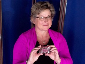 Crystal Regehr Westergard holds a Cuban Lunch, a rectangular peanut-and-chocolate confection, in an undated handout photo.THE CANADIAN PRESS/HO ORG XMIT: CPT602