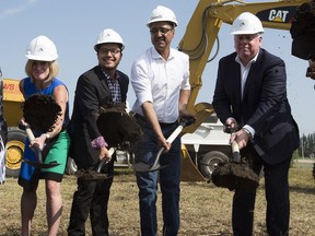 Premier Rachel Notley, left, Enoch Cree Nation Chief Billy Morin,  Natural Resources Minister Amarjeet Sohi and Kinder Morgan president Ian Anderson take part in the groundbreaking ceremony at the Enoch Cree Stockpile site on July 27, 2018 .