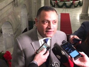 Calgary-Greenway MLA Prab Gill speaks in a media scrum in December 2018.