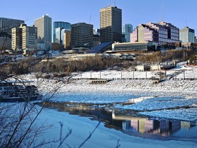 Ice floes float down the North Saskatchewan River with a view of downtown Edmonton, December 6, 2018.